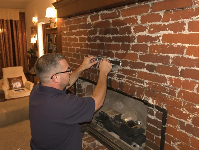 Walnut Chimney Sweep expert fixing a fireplace in Walnut, CA